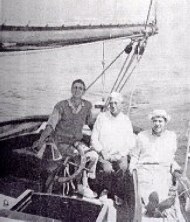 John Alden (center) aboard his own 390, 